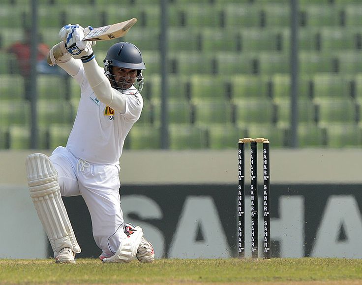 Kumar Sangakkara playing his trademark cover drive with elegance and timing, showing why he is celebrated as a master of batting